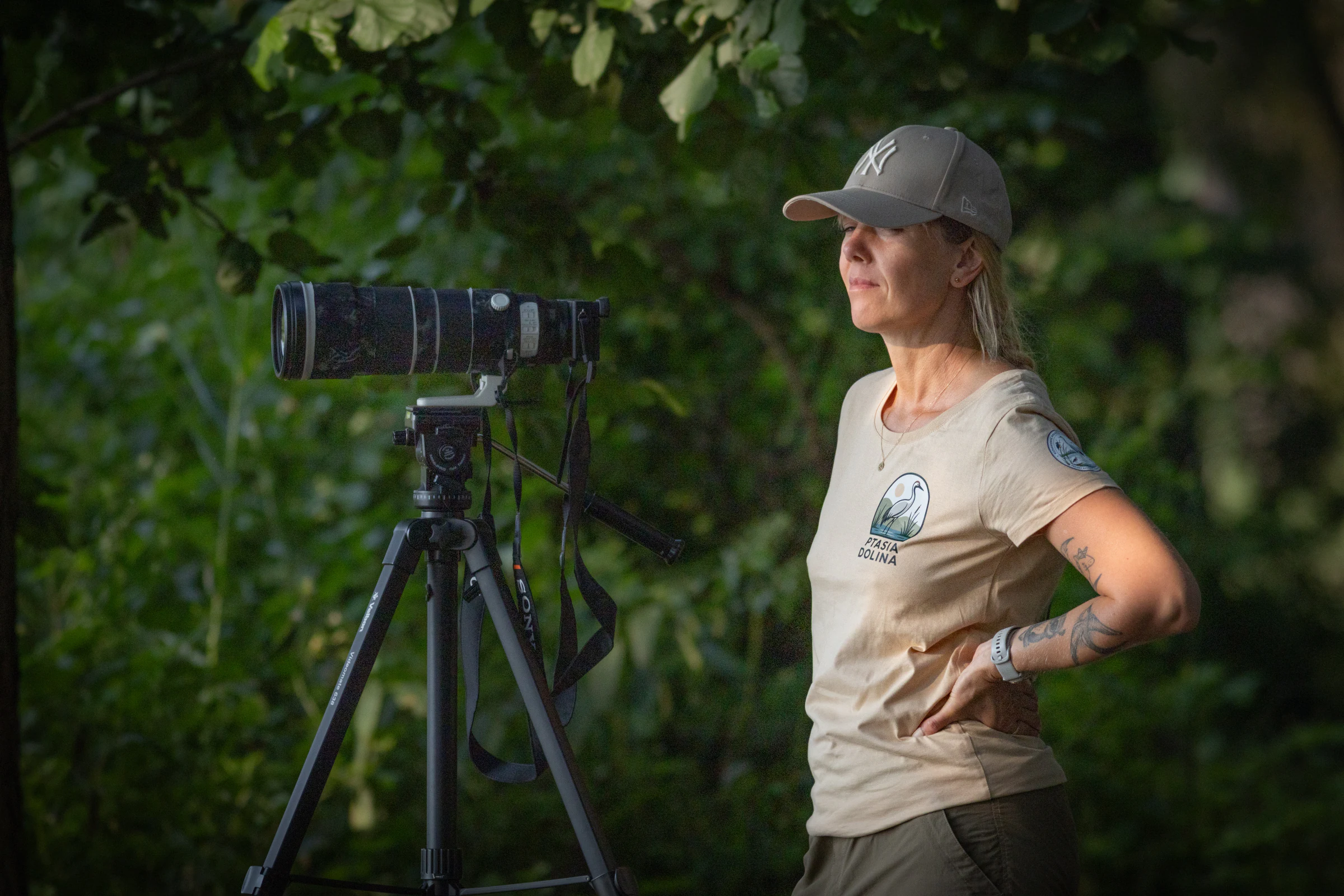 Agnieszka Murawiejko beside a camera on a tripod in the Barycz Valley